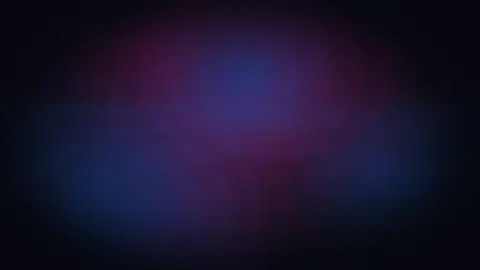 Keyframe of a crowd reacting under coloured light